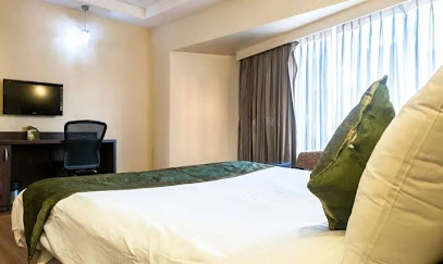 Hotel Mapple by green leavesâ