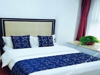 Guan County Hong Pu Traders Hotel