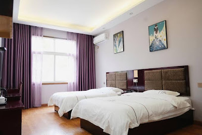 Xuan'en Junhua Business Hotel